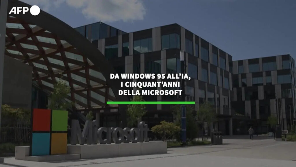 "Immagine commemorativa dei 50 anni di Microsoft, evidenziando l'evoluzione da Windows 95 all'intelligenza artificiale."