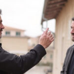 ALT: "Locandina del film 'Mani nude' di Mauro Mancini, con Francesco Gheghi e Alessandro Gassmann."
